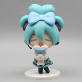 Hatsune Miku anime figurine holding a Cinnamoroll plush, kawaii tabletop collectible figure and doll model