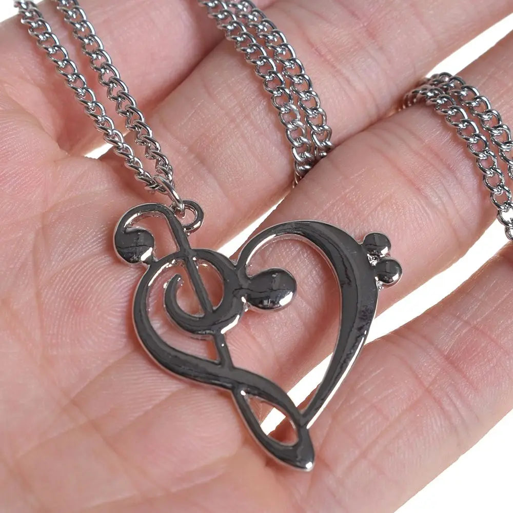 Silver music note heart necklace with treble and bass clef charms, infinity love pendant, stainless steel jewelry for women.