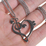 Silver music note heart necklace with treble and bass clef charms, infinity love pendant, stainless steel jewelry for women.
