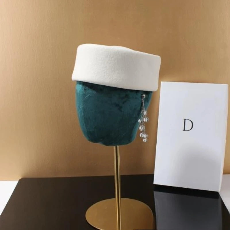 Women's wool felt beret hat with vintage hard concave top, pillbox design, and wedding fascinator style