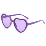 Pink love heart-shaped sunglasses for women with large frames, vintage style, UV400 protection, outdoor fashion eyewear.