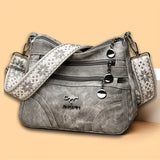 Vintage soft leather women's shoulder purse with multiple pockets and an ethnic pattern strap, ideal for everyday use.