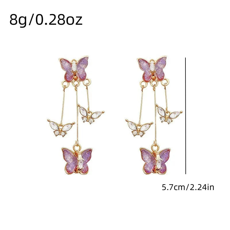 Purple butterfly drop earrings with rhinestone details by HSF Marketplace