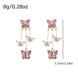 Purple butterfly drop earrings with rhinestone details by HSF Marketplace