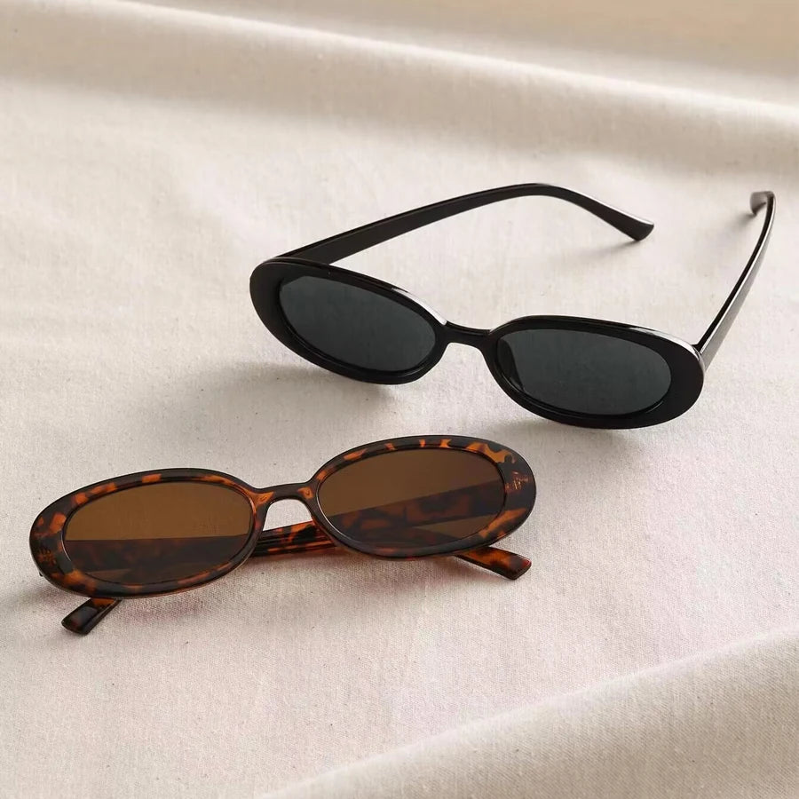 Vintage oval sunglasses for women by HSF Marketplace, black and red retro designer sunglasses with small oval lenses and elegant style.