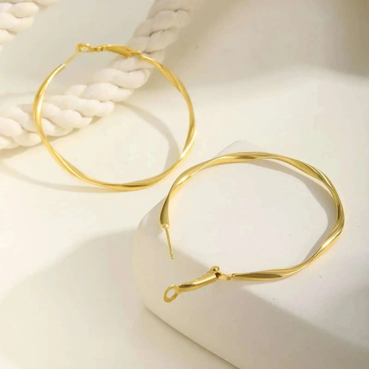 Stainless steel twist circle hoop earrings for women by HSF Marketplace