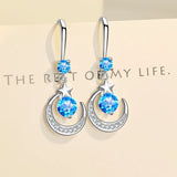Dangle star and moon earrings in 925 sterling silver with sapphire by HSF Marketplace