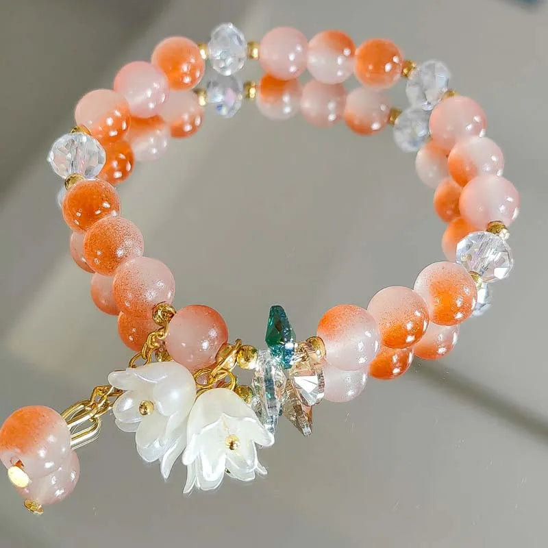 Colorful Lily Valley flower bracelet for women with crystal beads, elastic design, perfect for wedding or birthday jewelry.