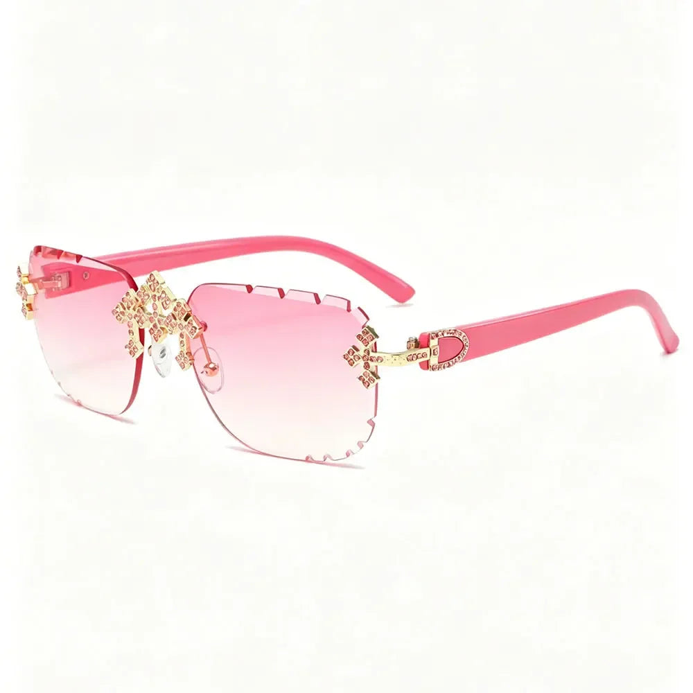 Luxury rimless square sunglasses for women with rhinestone details, UV400 protection, fashion cut lenses, and trendy diamond accents.