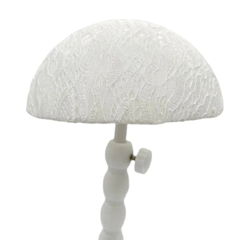 White plastic wig stand with mushroom top, portable and foldable, ideal for displaying short wigs and hair styling.