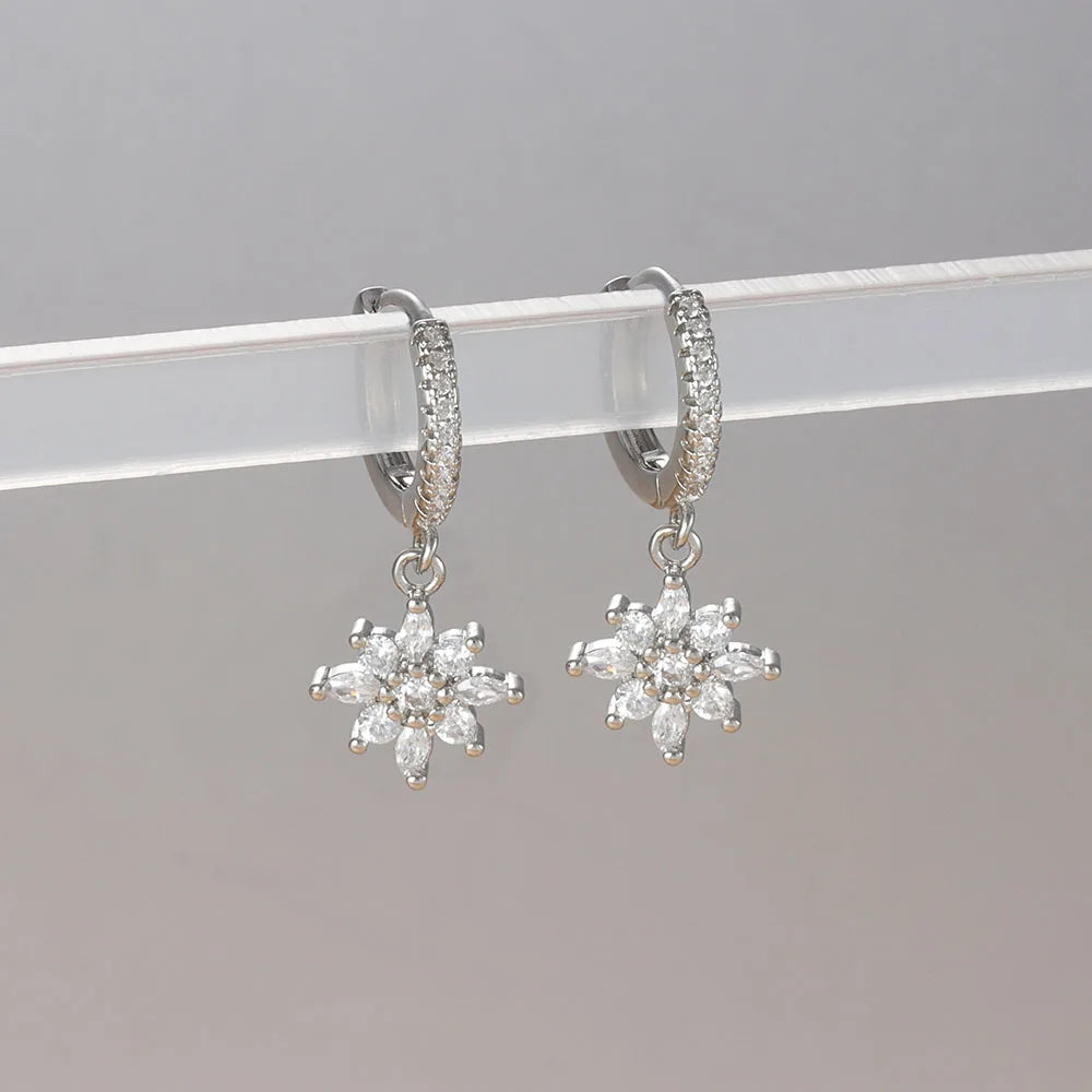 Stainless steel star dangle earrings with sparkling zircon accents by HSF Marketplace