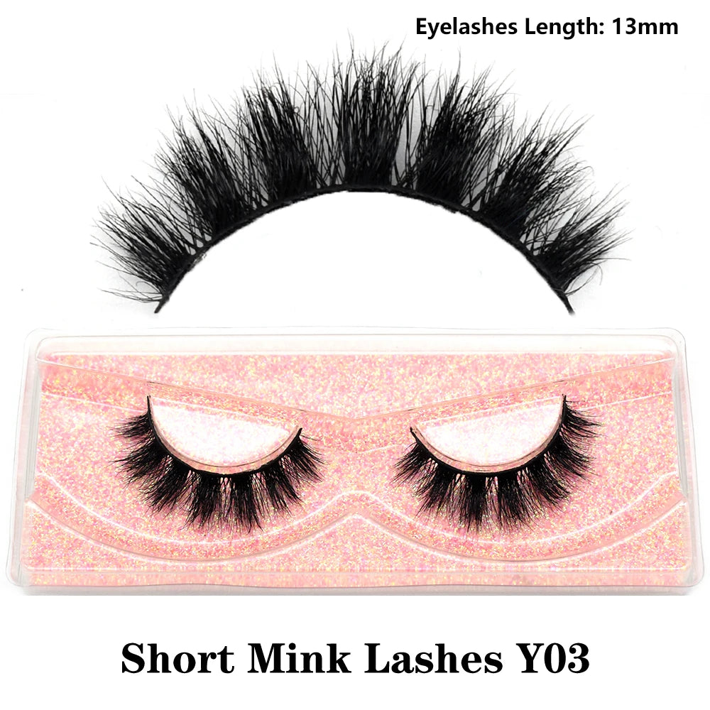 Fluffy wispy short clusters of 3D real mink false eyelashes in a natural lash tray