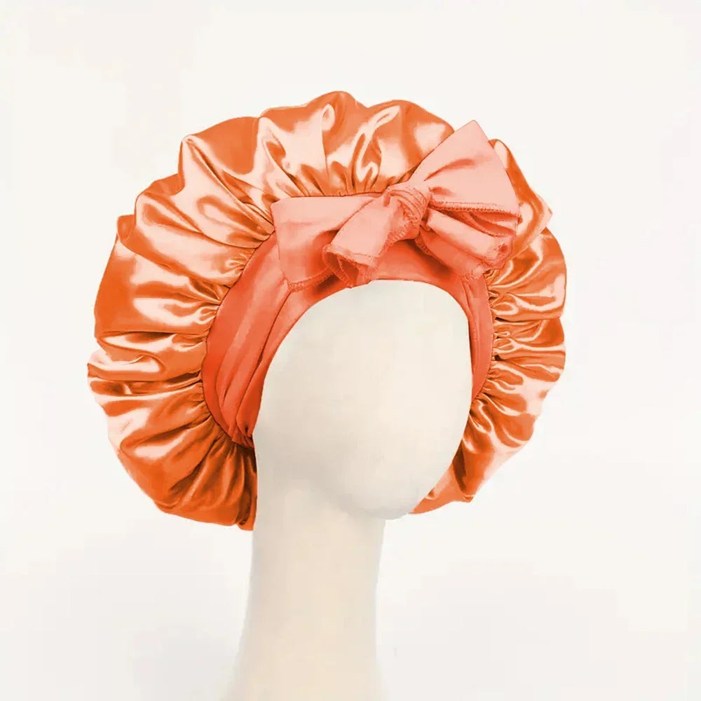 Silk satin sleep bonnet with adjustable tie band, suitable for women and men, designed for hair protection and styling.