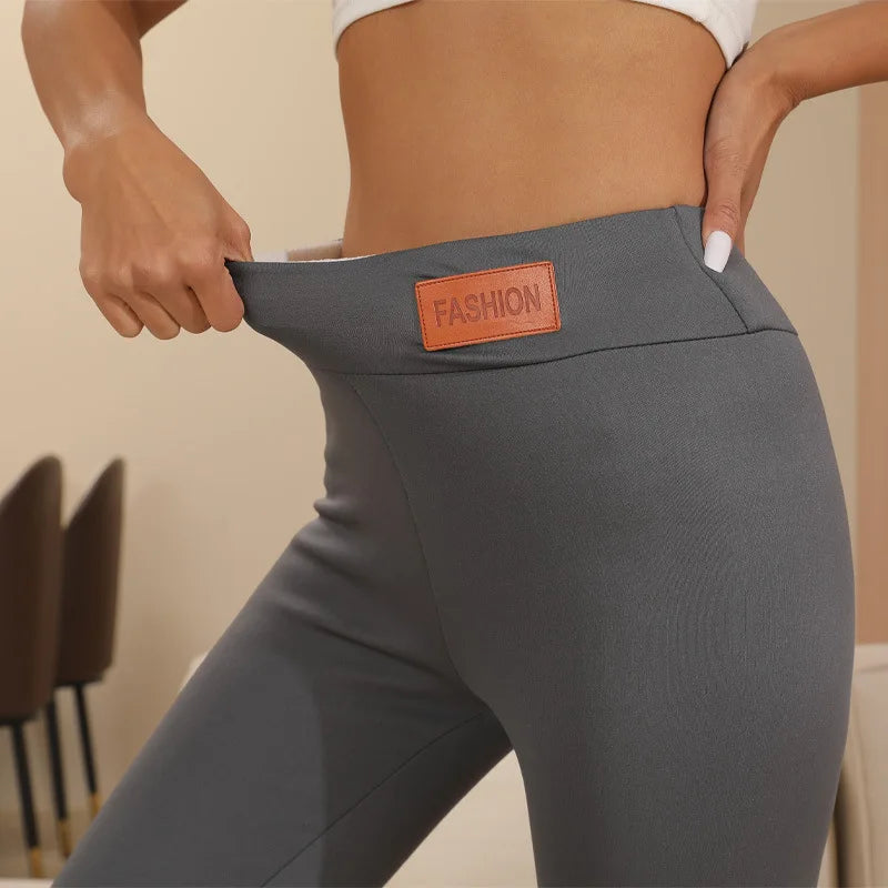 Women's winter fleece leggings with high waist, lamb cashmere lining, velvet finish, and elastic fit.