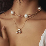 Golden stainless steel initial necklace for women, chunky bubble letter pendant, trendy jewelry gift for girls and women.