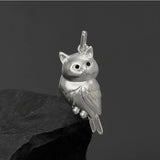 Golden silver textured 3D owl pendant necklace for women, featuring a cute, detailed owl design in jewelry style.