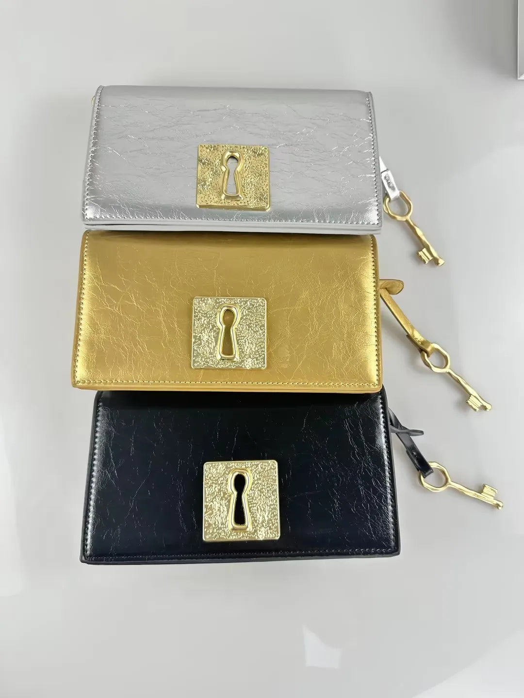 European American retro copper gold-plated geometric necklace with irregular shapes, displayed near handbags and purses.