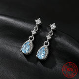 Sterling silver dangle drop earrings with sea blue CZ stones for women by HSF Marketplace