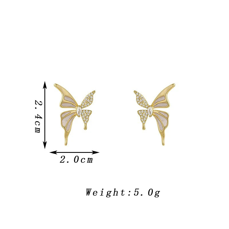 White enamel butterfly stud earrings with crystal wings and golden color metal for women