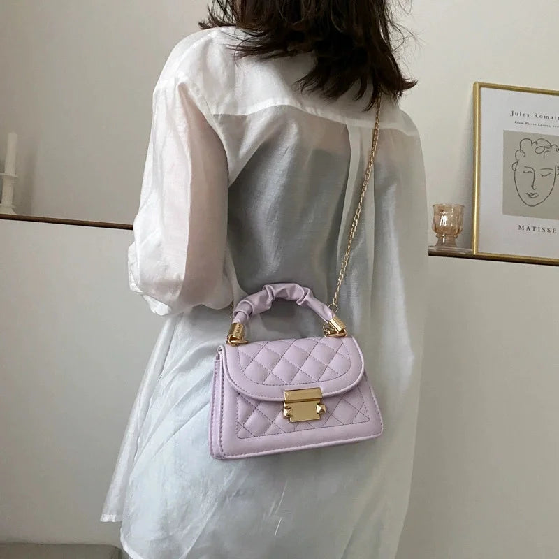 Luxury black PU leather shoulder handbag for women with underarm design, compact and stylish for everyday use.