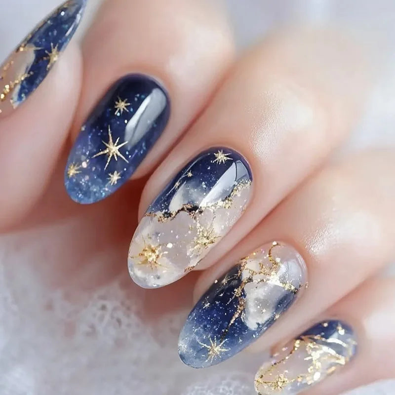 24-piece Y2K star press-on false nails with blue gradient French tips and gold moon designs, almond shape