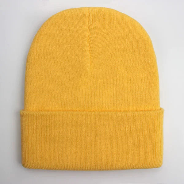 Unisex soft knitted winter beanie hat in a solid color, shown in one of 24 color options