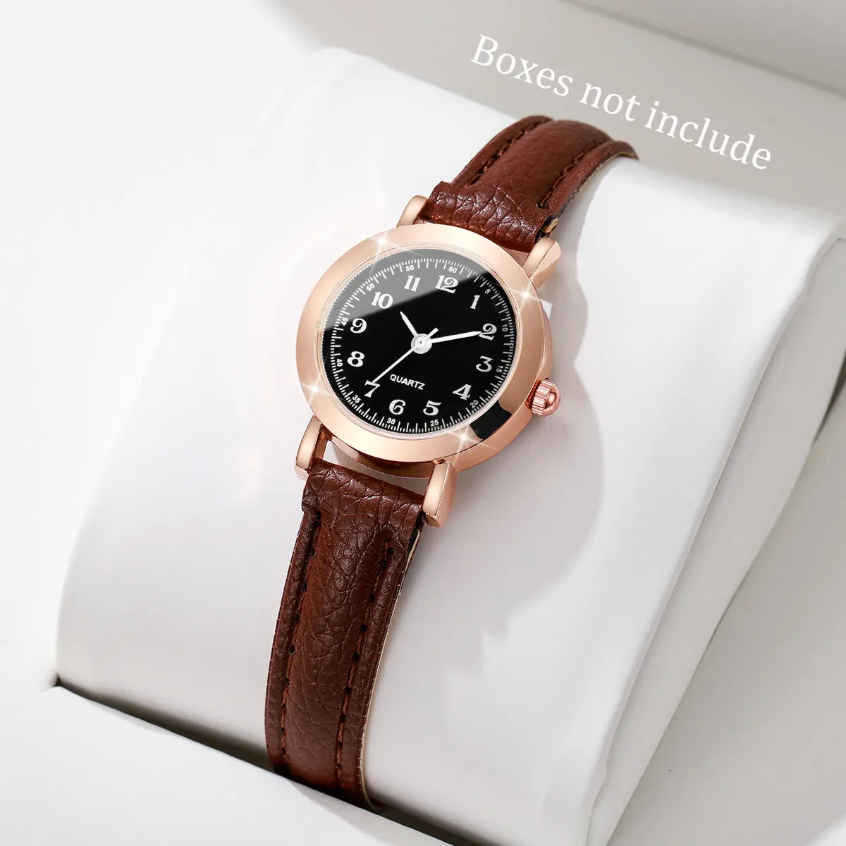 Fashion small dial women's watch with leather band and analog quartz movement, stylish accessory for ladies and girls.