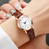 Women's fashion wristwatch with small dial, leather band, and analog quartz movement by HSF Marketplace.