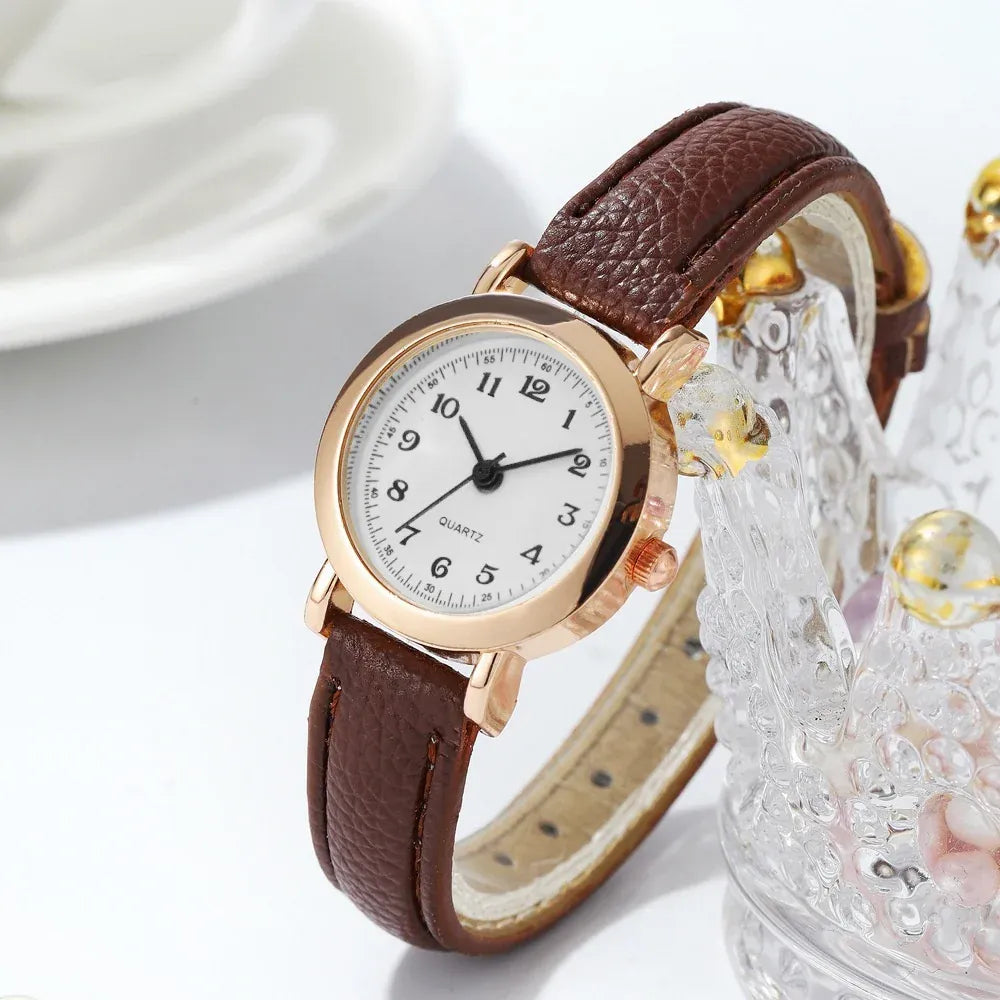 Fashion small dial women's leather band analog quartz wristwatch with a sleek design, suitable for girls and ladies.