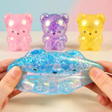 Glitter gummy bear squishy fidget toy from HSF Marketplace, soft sensory stress relief toy for squeezing and fun.