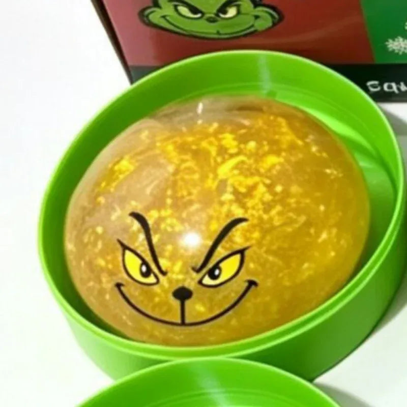 Green glitter dumpling stress toy with steamer design from HSF Marketplace, perfect for Christmas or New Year gift, sensory relief.