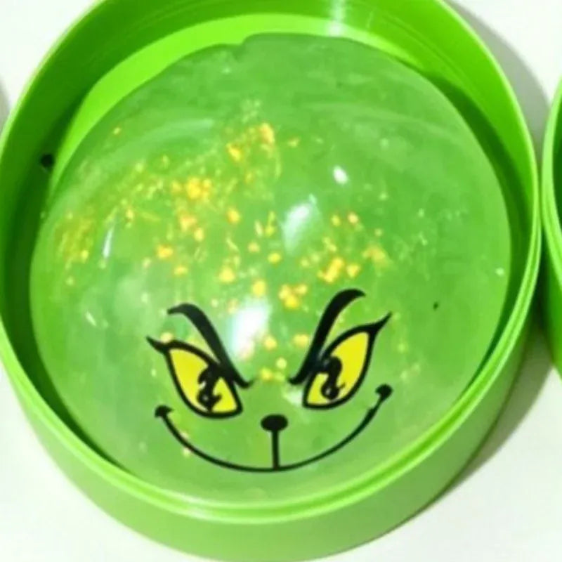 Green glitter dumpling stress toy with steamer design, squeezable sensory toy by HSF Marketplace, perfect for Christmas and New Year gifts.