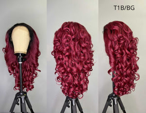 Sensationnel synthetic lace front wig with vibrant burgundy curls on mannequin heads