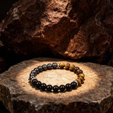Triple protection bracelet with tiger's eye, black obsidian, and black calcite crystal stones